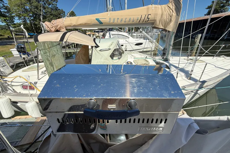 Slide: The Image of Stainless steel grill on a 2010 Leopard 38 sailboat docked at a marina. - 22