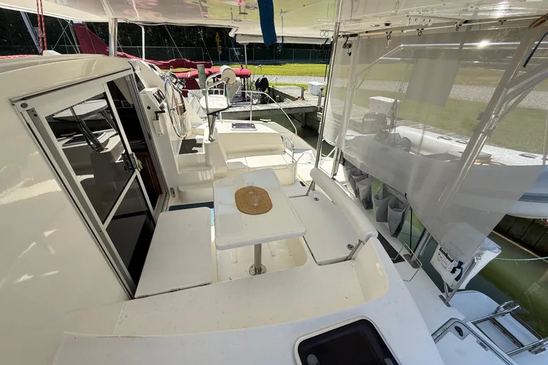 Slide: The Image of 2010 Leopard 38 catamaran interior with seating area and helm station. - 23