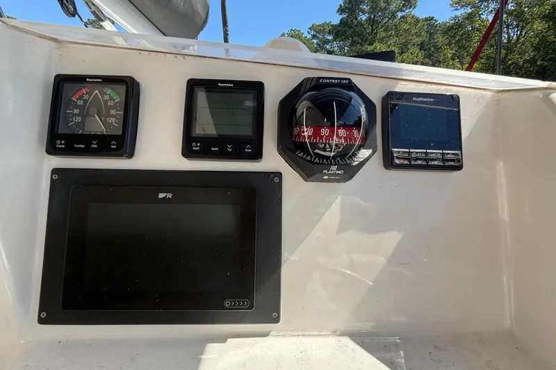 Slide: The Image of Control panel of a 2010 Leopard 38 boat with navigation instruments. - 30