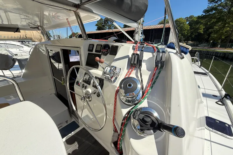 Slide: The Image of Cockpit of 2010 Leopard 38 catamaran with steering wheel and control panel. - 31
