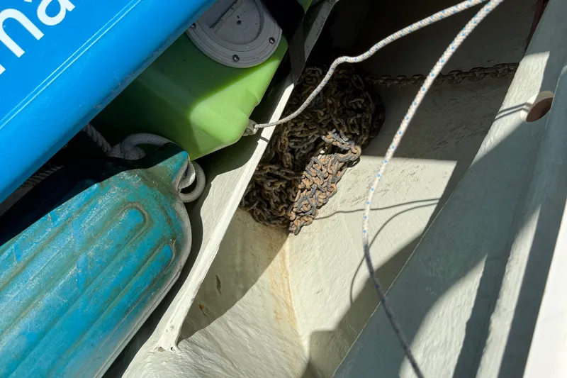 Slide: The Image of Boat equipment storage with ropes, chains, and fenders on a 2010 Leopard 38. - 37