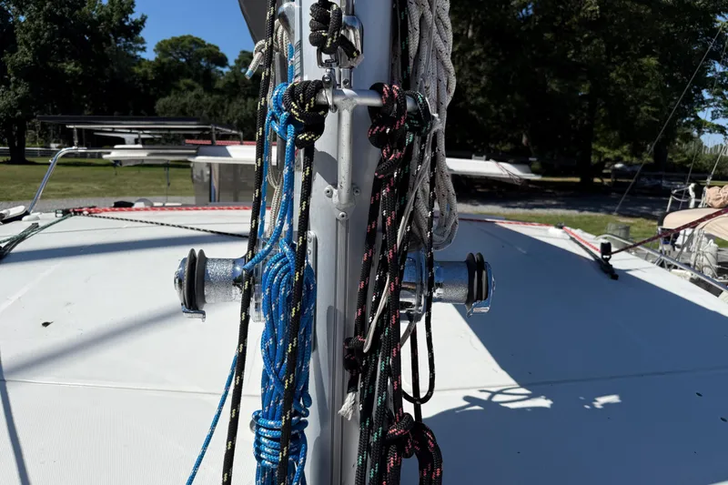 Slide: The Image of Sailboat mast with colorful ropes on a 2010 Leopard 38 catamaran. - 39