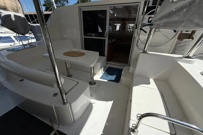 Slide: The Image of 2010 Leopard 38 yacht cockpit with seating, table, and helm station. - 49