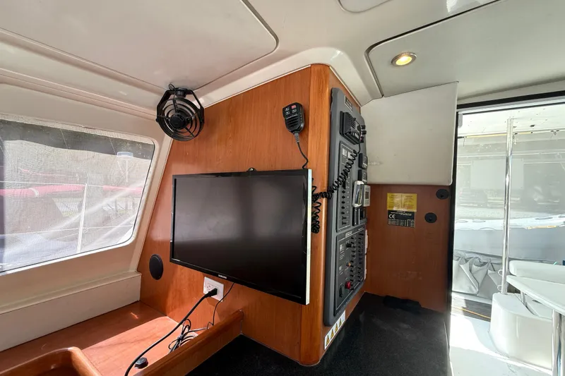 Slide: The Image of Interior of 2010 Leopard 38 yacht with control panel and mounted TV. - 58