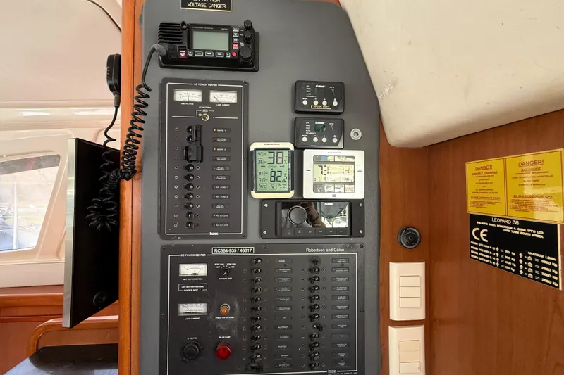 Slide: The Image of Control panel of a 2010 Leopard 38 yacht, featuring navigation and communication equipment. - 59