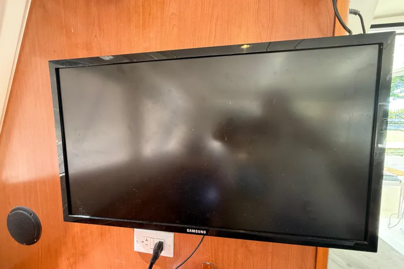 Slide: The Image of Samsung TV mounted on wooden panel inside a 2010 Leopard 38 model. - 63