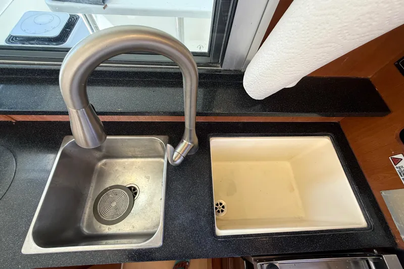 Slide: The Image of Dual sinks with modern faucet in 2010 Leopard 38 yacht kitchen. - 65