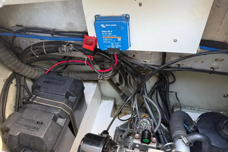 Slide: The Image of Engine compartment of a 2010 Leopard 38 with Victron Energy charger and wiring. - 76