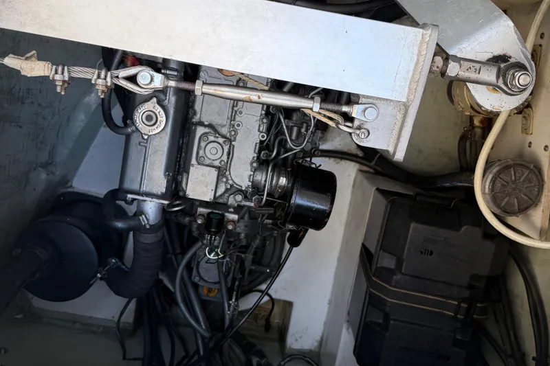 Slide: The Image of Engine compartment of a 2010 Leopard 38 catamaran, showcasing mechanical components and wiring. - 77