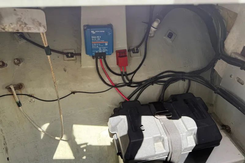 Slide: The Image of Electrical setup in a 2010 Leopard 38 boat, featuring a Victron Energy charger. - 78