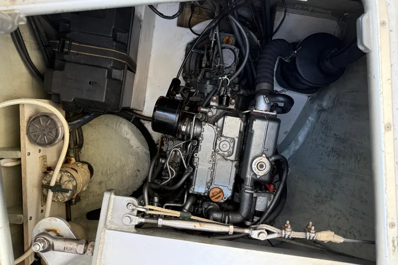 Slide: The Image of Engine compartment of a 2010 Leopard 38, showcasing mechanical components and wiring. - 81