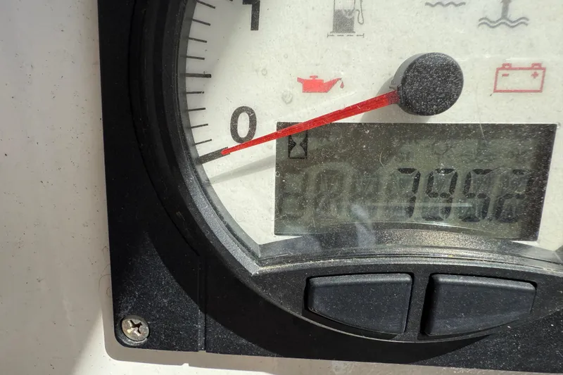 Slide: The Image of Close-up of a Leopard 38 engine gauge displaying 7952 hours. - 86