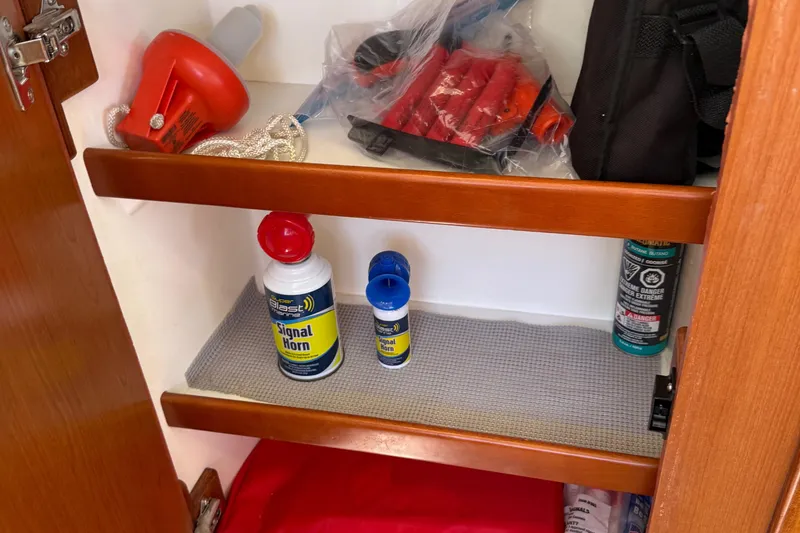 Slide: The Image of Storage shelf on Leopard 38 yacht with signal horns and safety equipment. - 89