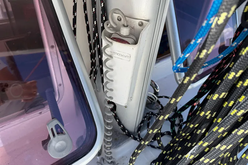 Slide: The Image of Sailing ropes and winch handle on a 2010 Leopard 38 catamaran deck. - 90