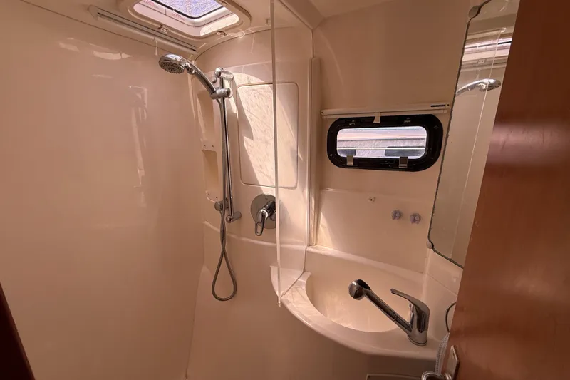Slide: The Image of Bathroom interior of a 2010 Leopard 38 yacht with shower and sink. - 95