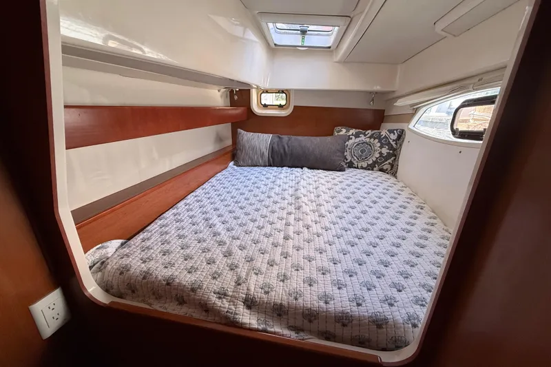 Slide: The Image of Cozy cabin interior of 2010 Leopard 38 yacht with comfortable bedding and natural light. - 96