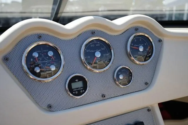 Slide: The Image of Dashboard of 2015 Chris-Craft Capri 21 boat with classic gauges and controls. - 10