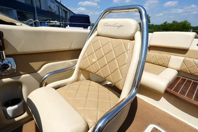 Slide: The Image of Luxurious interior of 2015 Chris-Craft Capri 21 boat with beige leather seating. - 8
