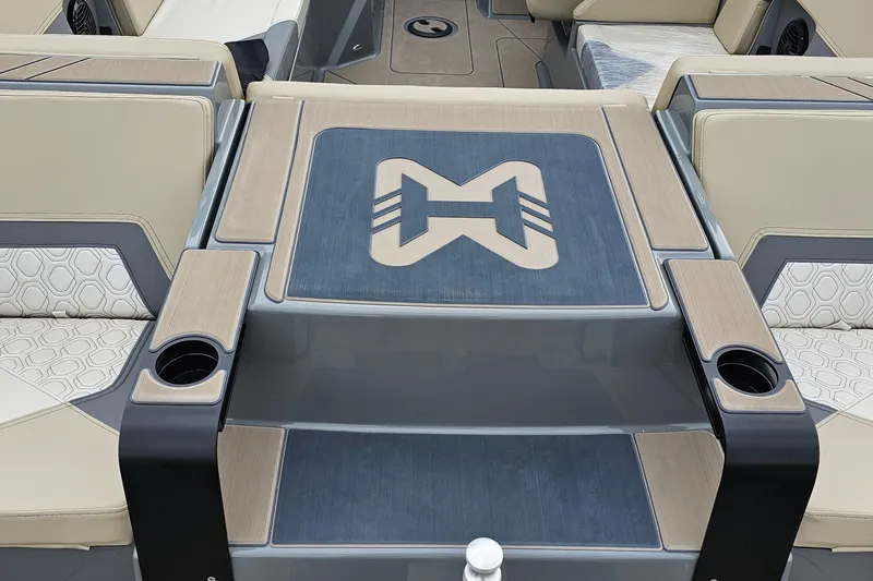 Slide: The Image of 2025 Heyday H20 boat interior with stylish seating and integrated cup holders. - 11