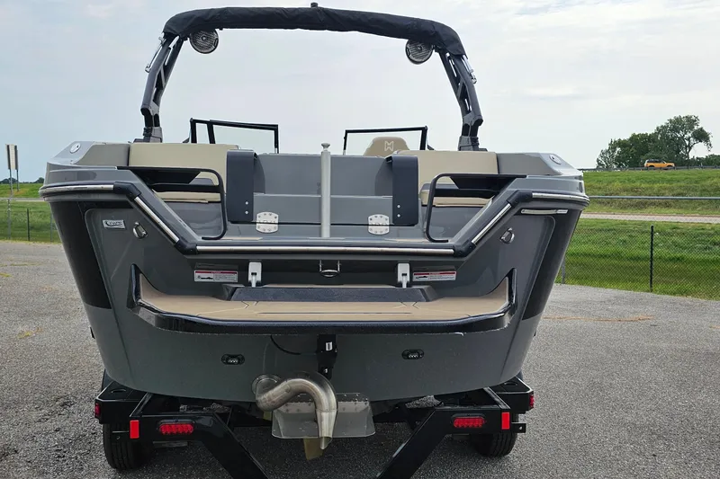 Slide: The Image of 2025 Heyday H20 boat rear view on trailer, showcasing sleek design and seating. - 3