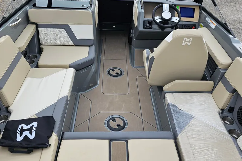 Slide: The Image of 2025 Heyday H20 boat interior with beige seating, modern dashboard, and stylish design. - 5