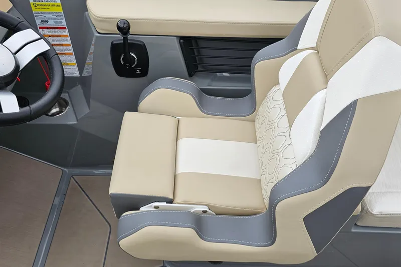Slide: The Image of 2025 Heyday H20 boat interior with beige and gray captain's seat and steering wheel. - 6