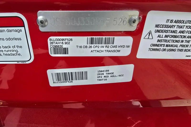 Slide: The Image of 2026 Tahoe T16 boat identification labels on red hull with safety instructions. - 6