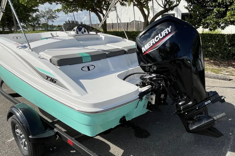 Slide: The Image of 2026 Tahoe T16 boat with Mercury engine, parked on a trailer. - 65