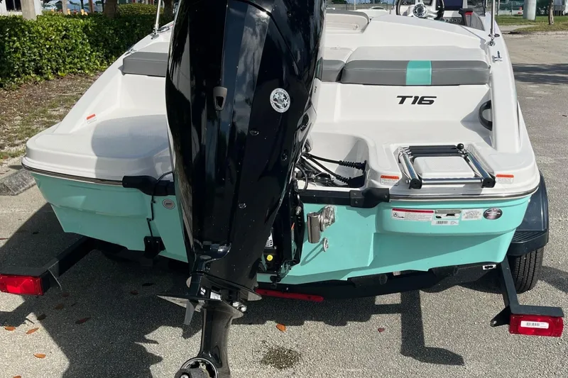Slide: The Image of 2026 Tahoe T16 boat with outboard motor, parked on a trailer. - 8