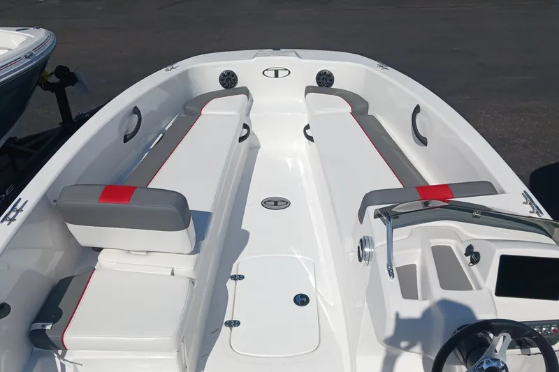 Slide: The Image of 2026 Tahoe T18 boat interior with white and gray seating, red accents, and steering console. - 4