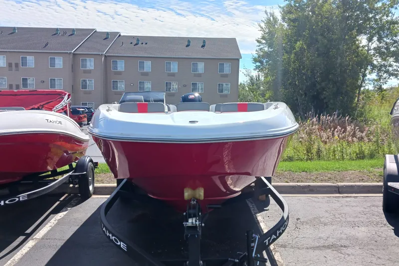 Slide: The Image of 2026 Tahoe T18 boat in parking lot, red and white design, sunny day. - 3