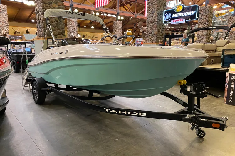 The Image of 2026 Tahoe T18 boat displayed indoors, featuring a sleek design and light blue hull. - 0