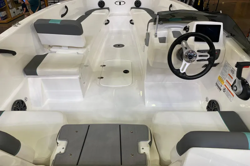 Slide: The Image of 2026 Tahoe T18 boat interior with modern steering and seating layout. - 4