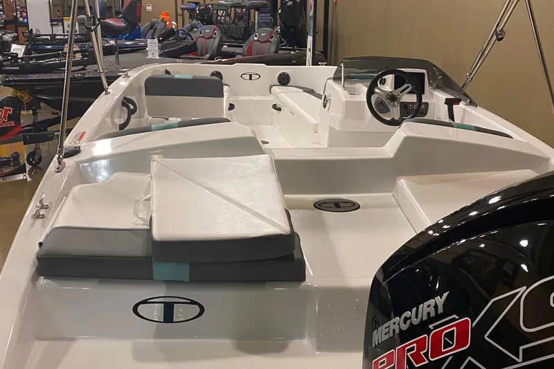 Slide: The Image of 2026 Tahoe T18 boat interior with seating and Mercury Pro XS engine. - 2