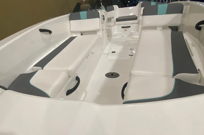 Slide: The Image of 2026 Tahoe T18 boat interior with white and gray seating, featuring teal accents. - 3