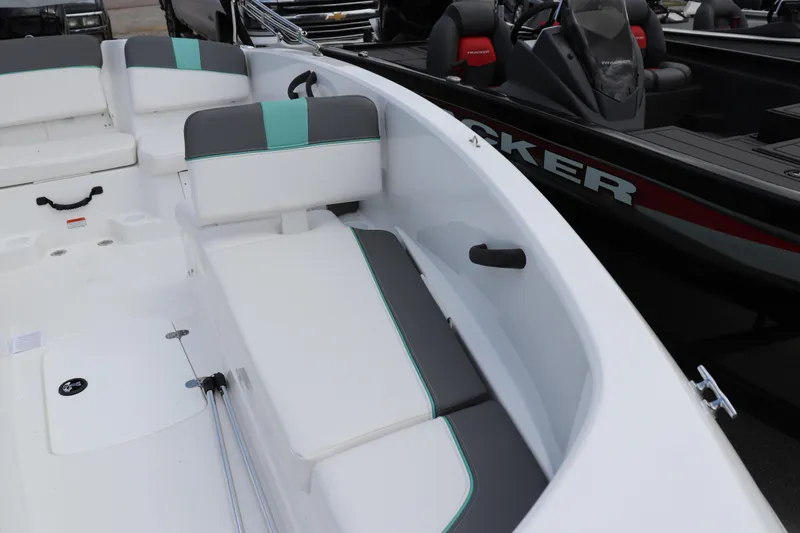 Slide: The Image of 2026 Tahoe T16 boat interior with white and teal seating, showcasing modern design. - 3