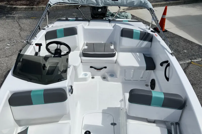 Slide: The Image of 2026 Tahoe T16 boat interior with seating, steering wheel, and windshield. - 3