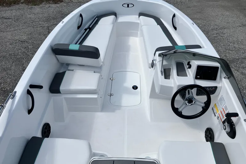 Slide: The Image of 2026 Tahoe T16 boat interior with seating, steering wheel, and control panel. - 4