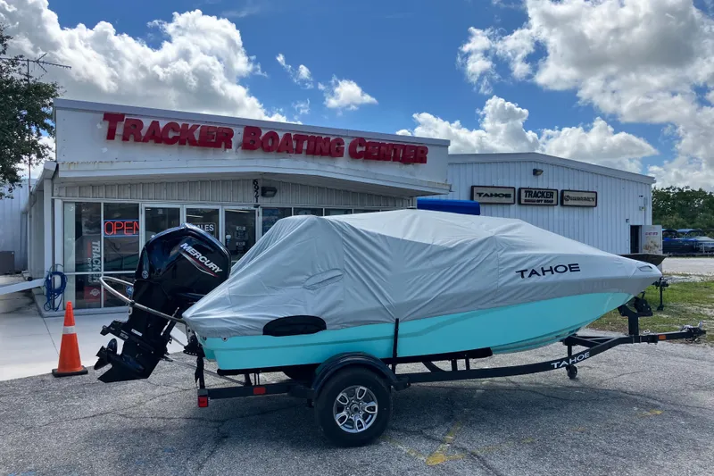 Slide: The Image of 2026 Tahoe T16 boat covered, parked outside Tracker Boating Center. - 7