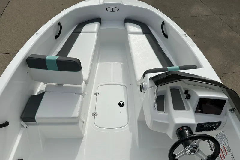 Slide: The Image of 2026 Tahoe T16 boat interior with seating and steering console, showcasing modern design. - 3
