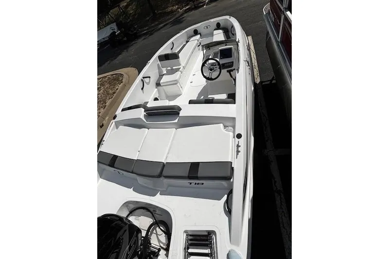 Slide: The Image of 2026 Tahoe T18 boat with sleek white design and spacious seating. - 3