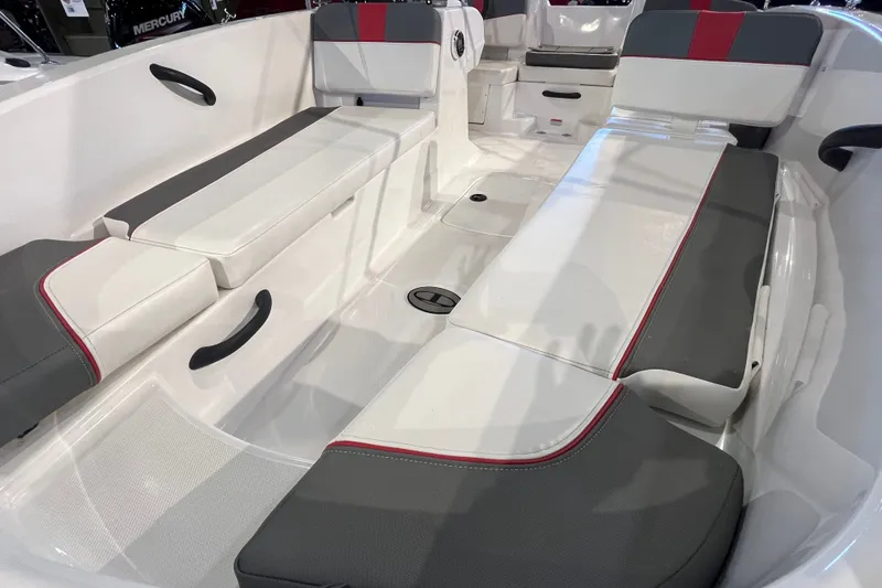 Slide: The Image of 2026 Tahoe T18 boat interior with white and gray seating, featuring red accents. - 12