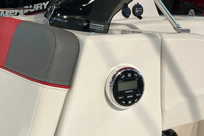 Slide: The Image of Interior of 2026 Tahoe T18 boat featuring audio controls and stylish seating. - 14
