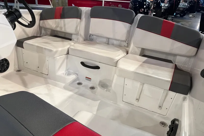 Slide: The Image of 2026 Tahoe T18 boat interior with white and gray seating, red accents, and storage compartments. - 13
