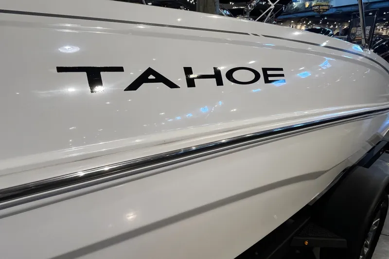 Slide: The Image of 2026 Tahoe T18 boat side view with logo in showroom lighting. - 4