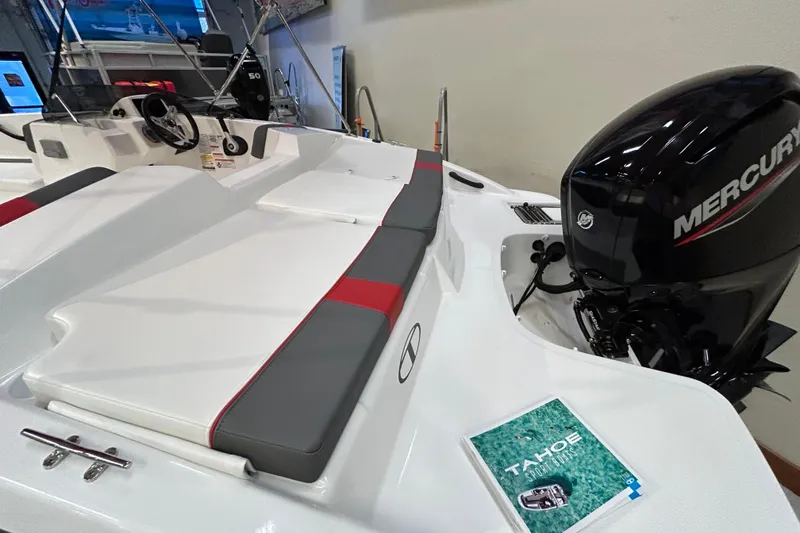 Slide: The Image of 2026 Tahoe T18 boat with Mercury engine, featuring sleek seating and control panel. - 5