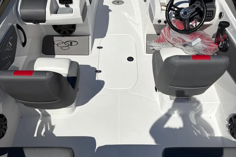 Slide: The Image of 2026 Tahoe T21 boat interior with dual seats, steering wheel, and modern dashboard. - 2