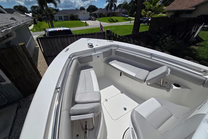 Slide: The Image of 2018 Sea Pro 219 Center Console boat with spacious seating and sleek design. - 11