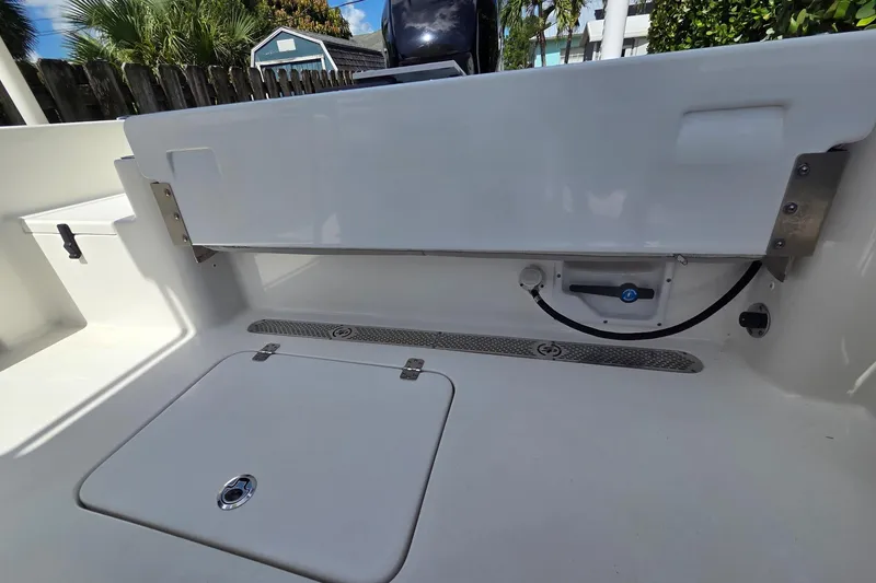 Slide: The Image of 2018 Sea Pro 219 Center Console boat interior with storage compartment and clean design. - 12