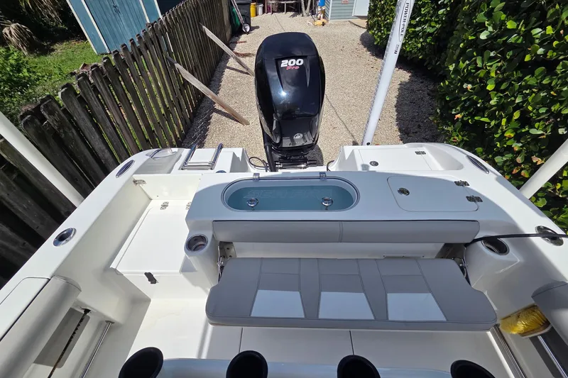 Slide: The Image of 2018 Sea Pro 219 Center Console boat with powerful 200 HP engine, spacious seating. - 13